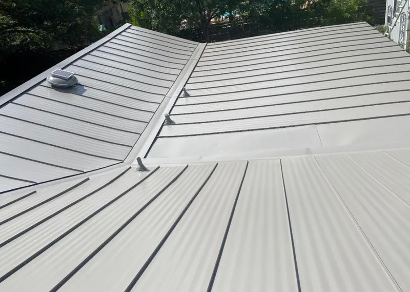 Solar attic fan installed on a metal roof for Roof Ventilation in Coeur d'Alene